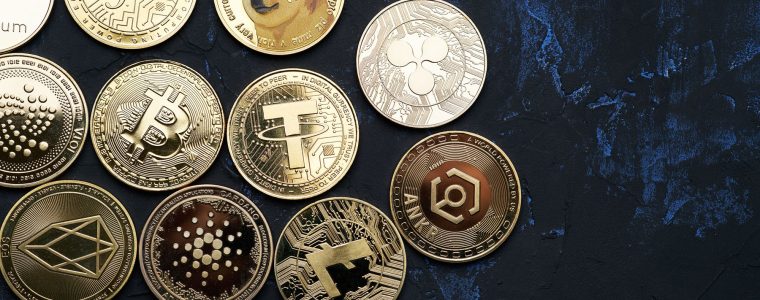 Background of various cryptocurrencies on textured background and view from above